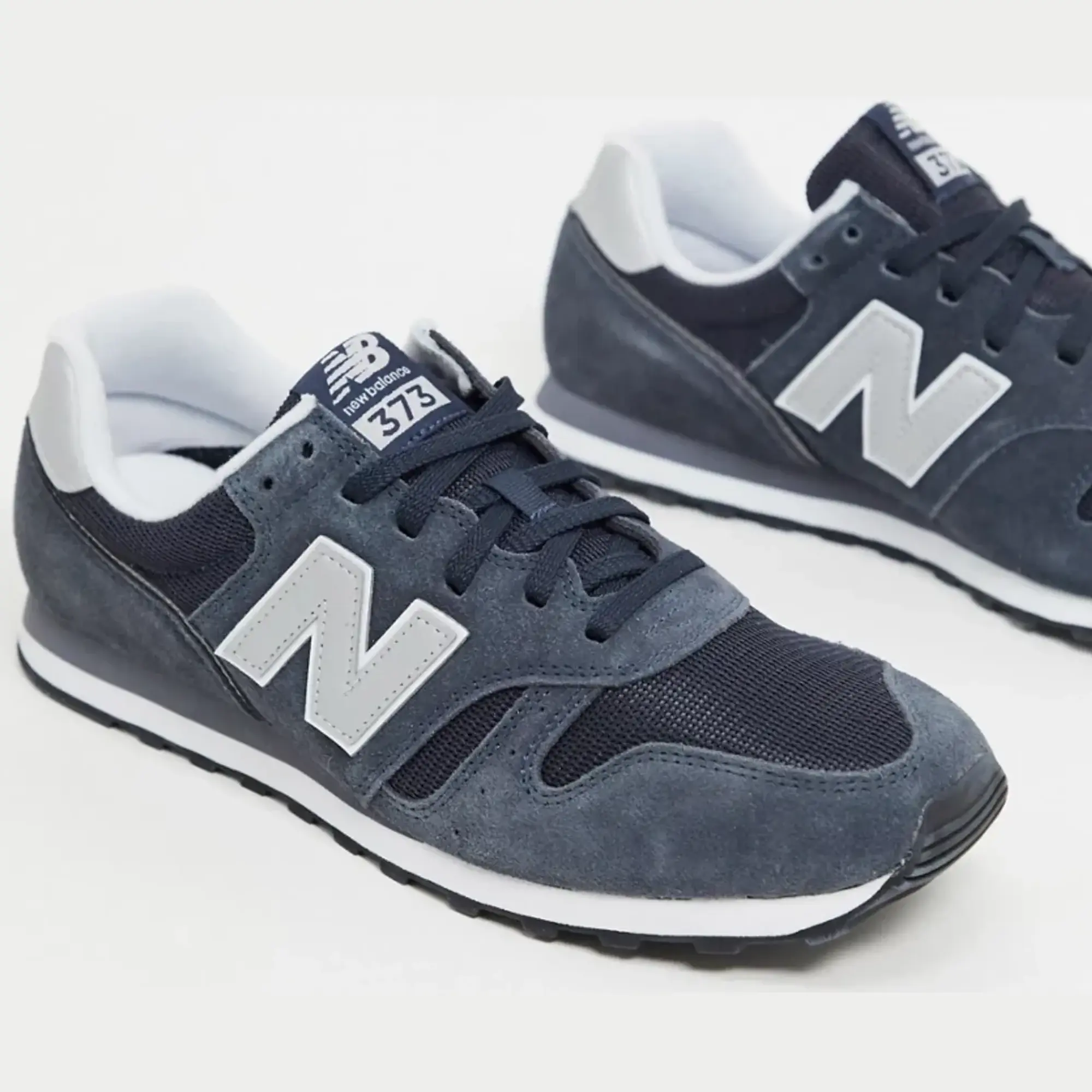 New Balance 373 Trainers In Navy And Grey