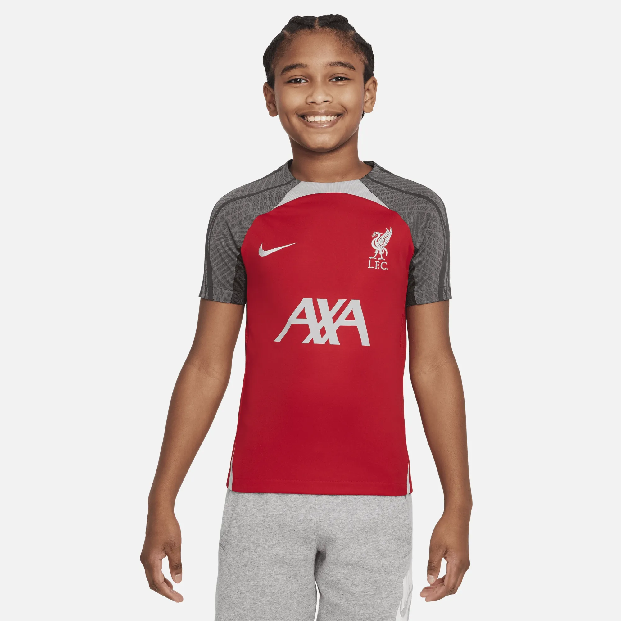 Liverpool F.C. Strike Older Kids' Nike Dri-FIT Football Knit Top - Red - Recycled Polyester