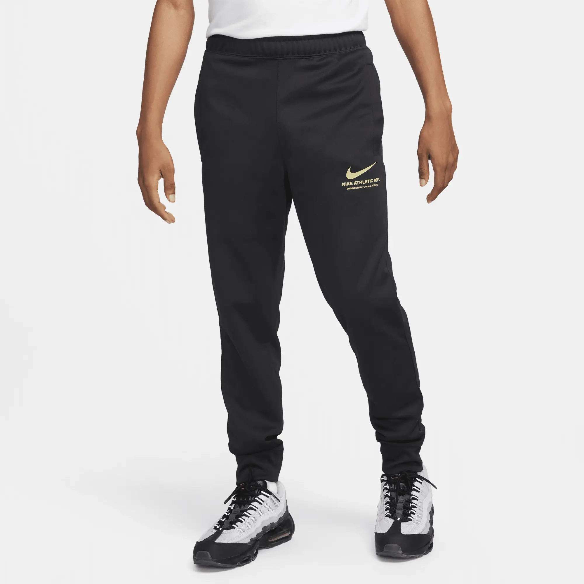 Black and gold nike track pants best sale