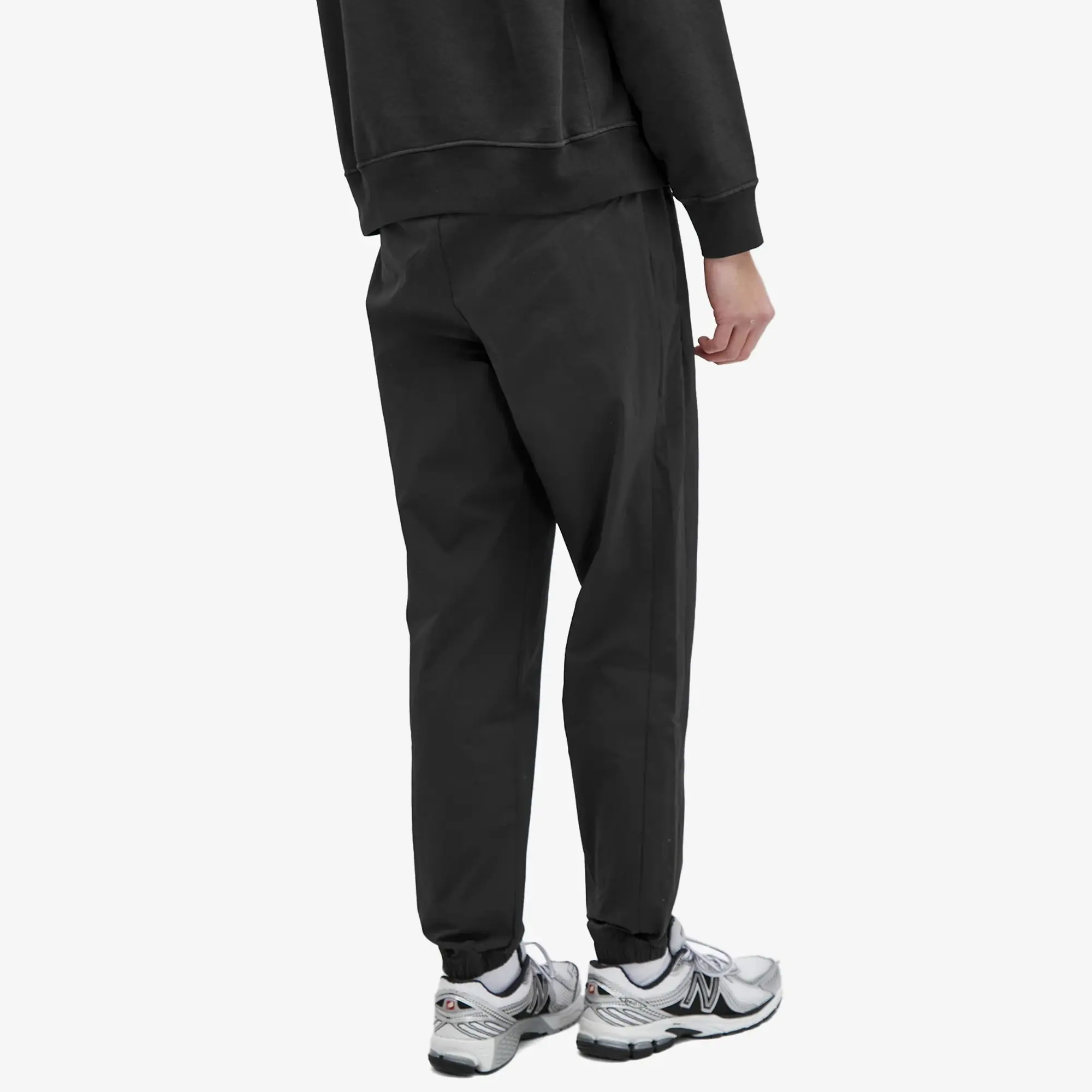 New Balance Men's Athletics Stretch Woven Jogger in Black Nylon Woven