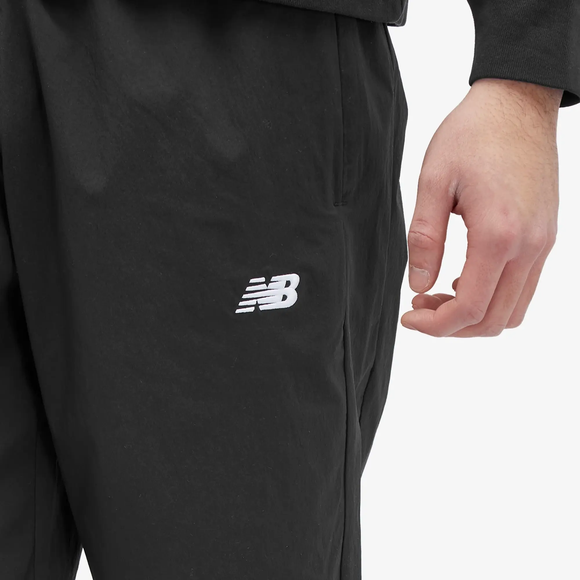 New Balance Men's Athletics Stretch Woven Jogger in Black Nylon Woven