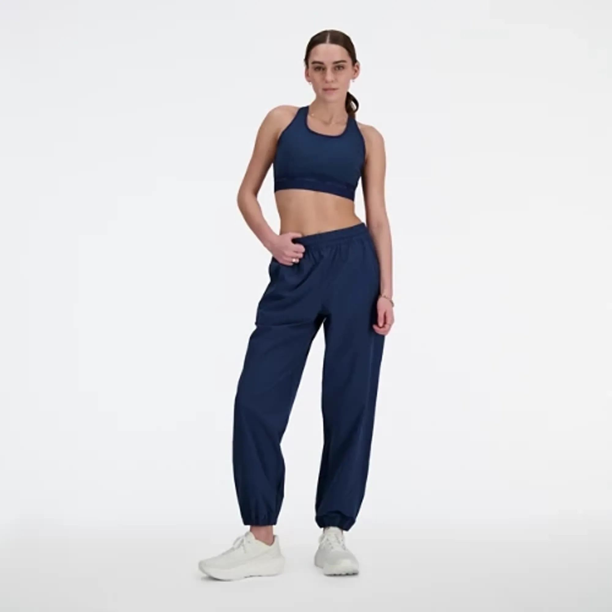 New Balance Women's Athletics Stretch Woven Jogger in Blue Poly Knit