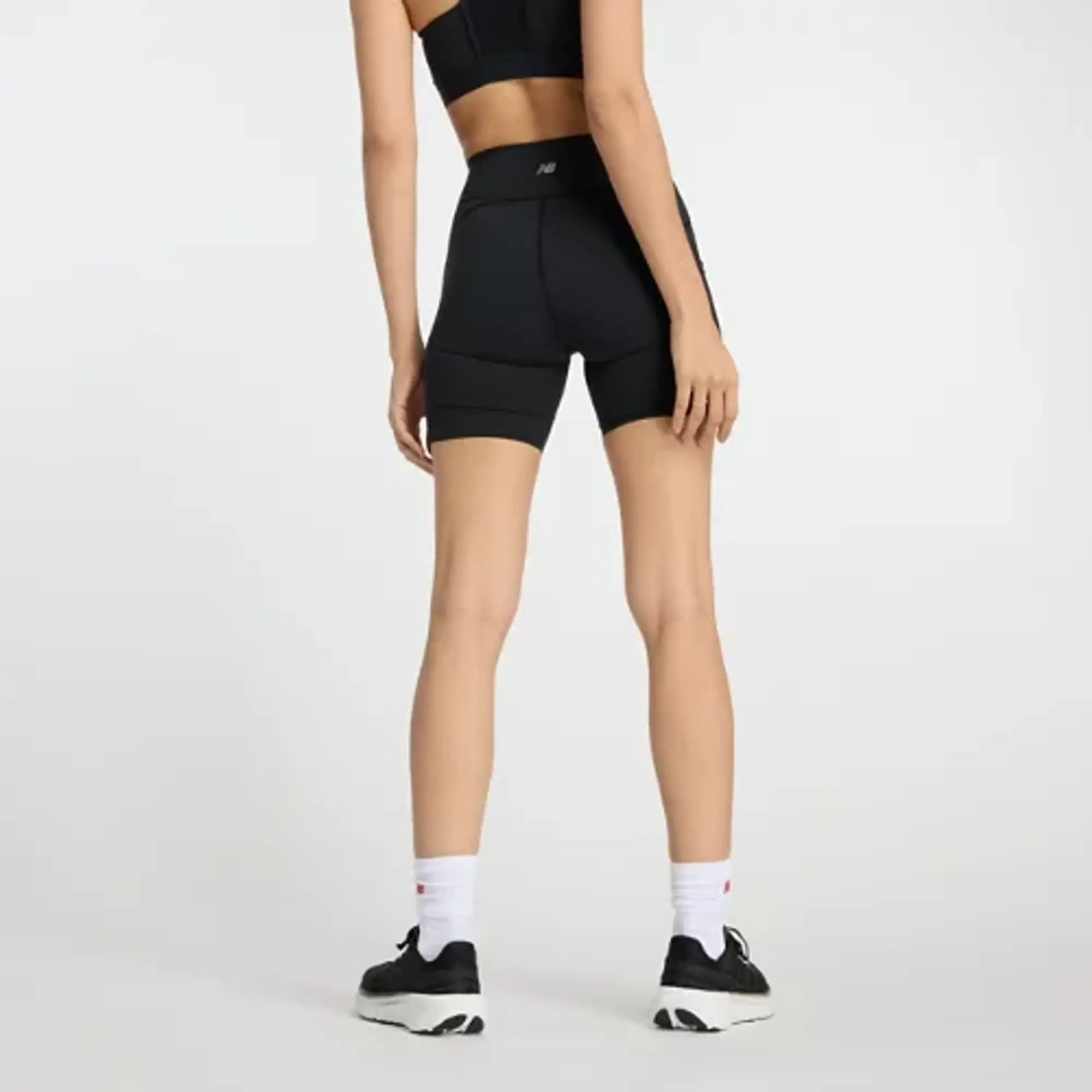 New Balance Women's NB Sleek Pocket High Rise Short 6 in Black Poly Knit