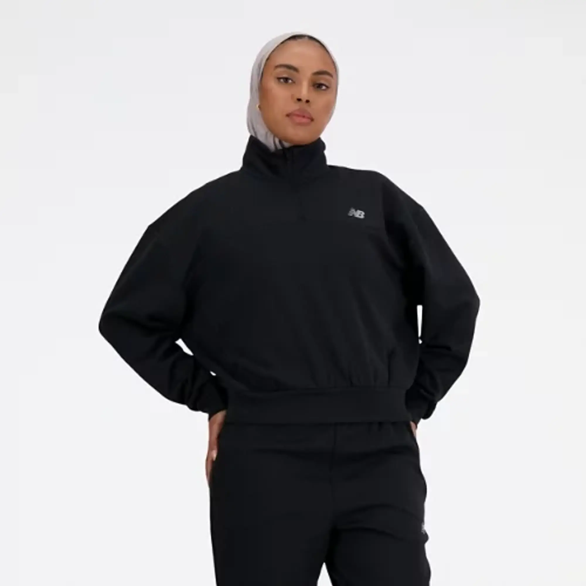 New Balance Women's Tech Knit Oversized Quarter Zip in Black Poly Knit