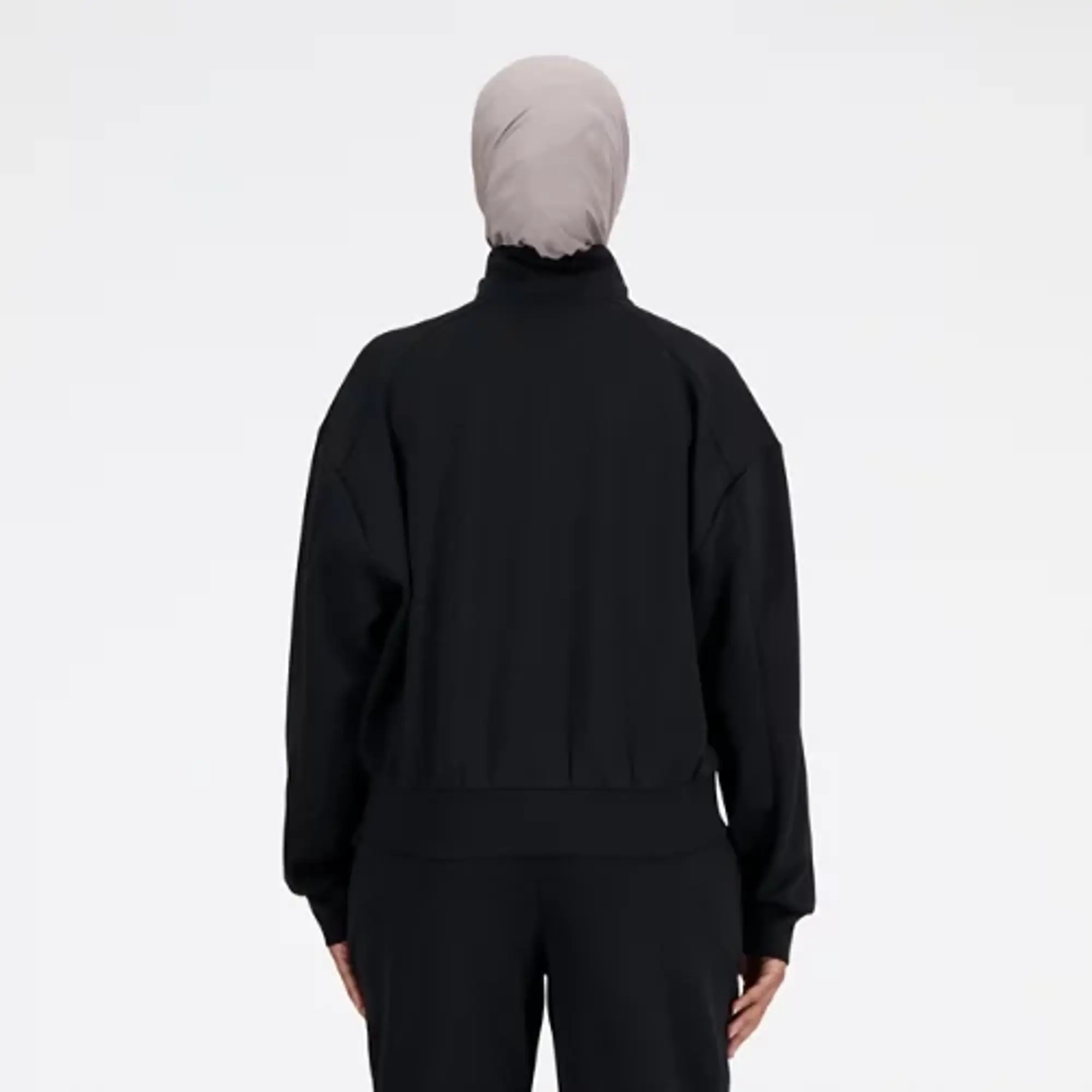 New Balance Women's Tech Knit Oversized Quarter Zip in Black Poly Knit