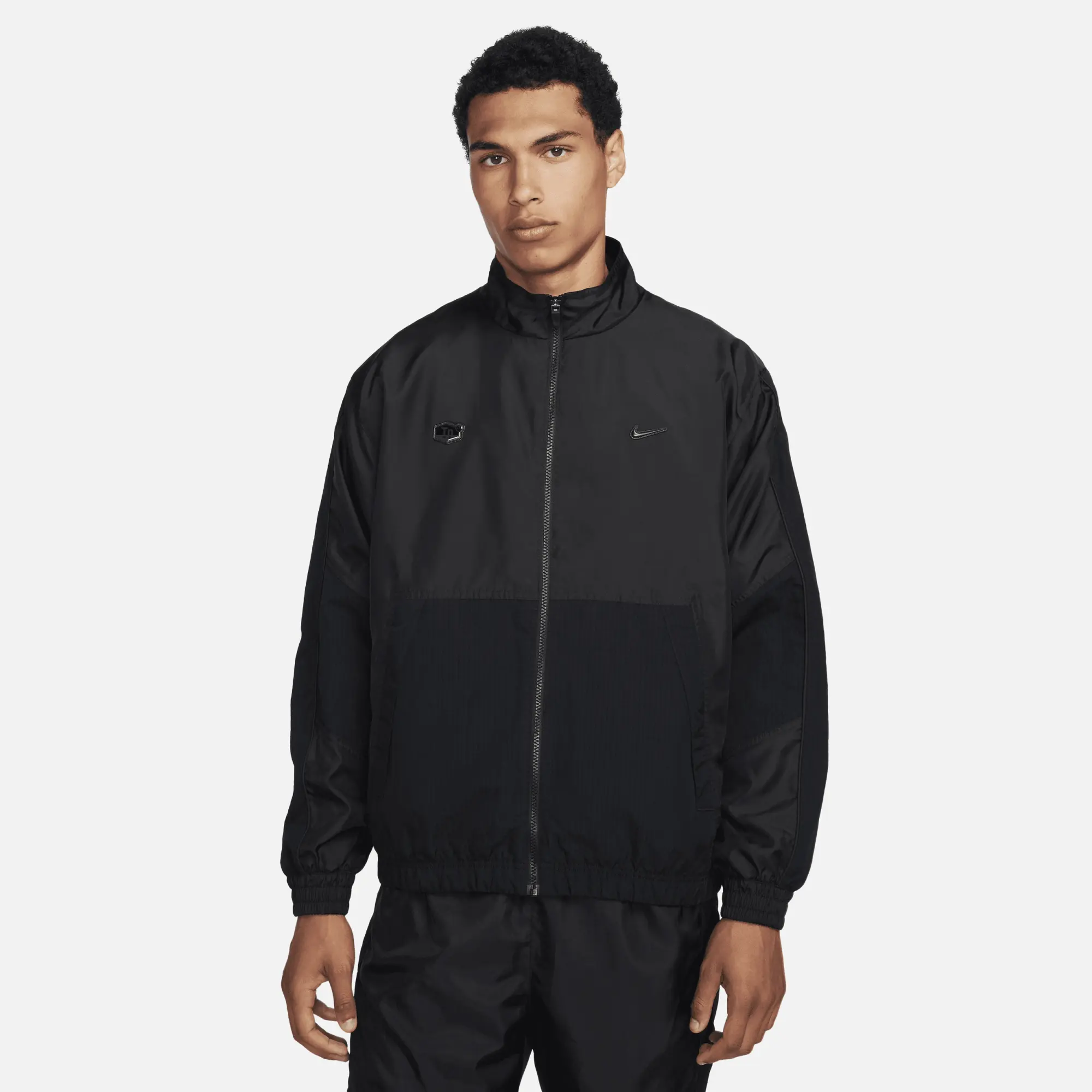 Nike woven tracksuit black best sale