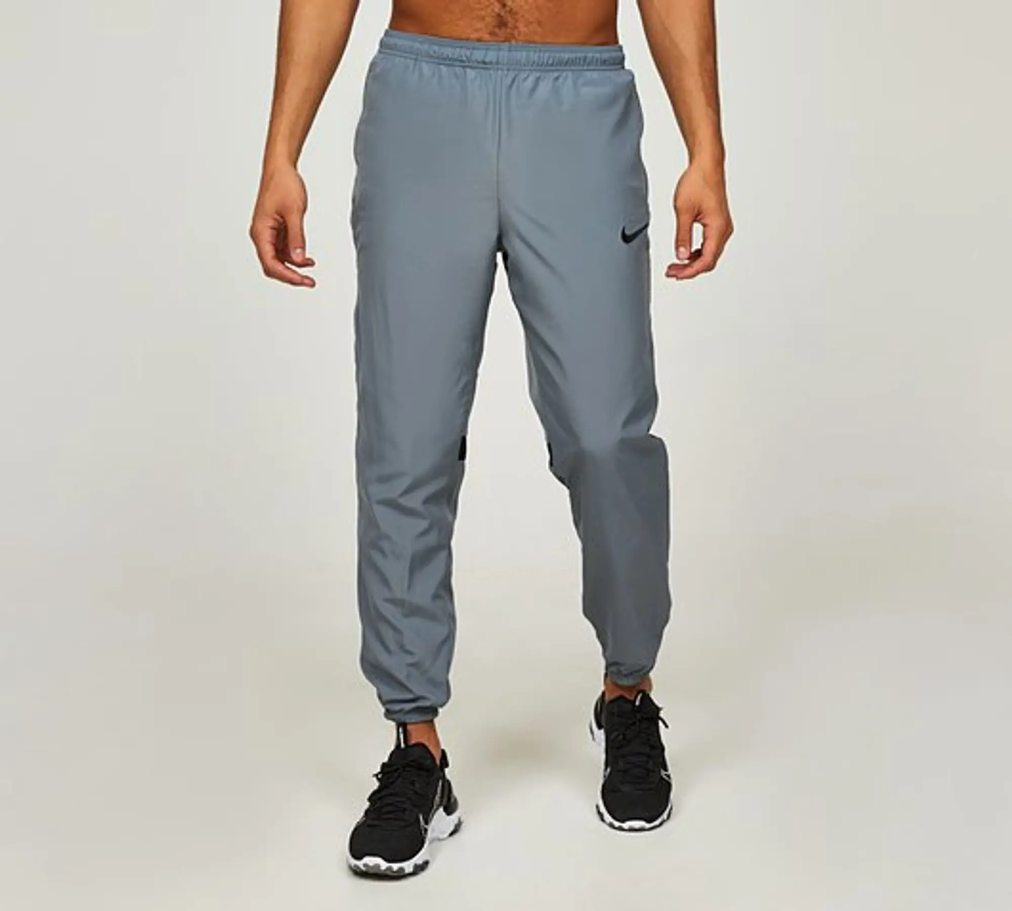 Nike woven track pants grey sale