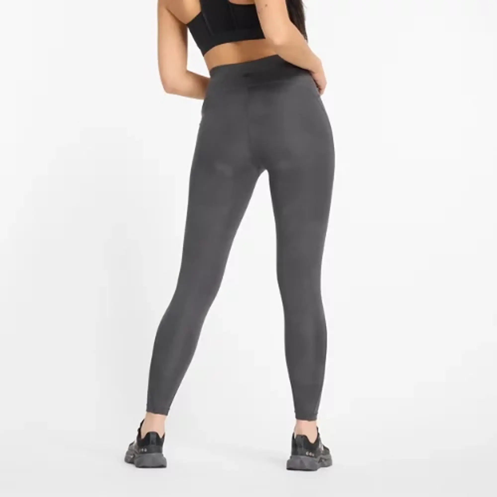 New Balance Women's Athletics Reflective Warming High Rise Legging 27 in Black Poly Knit