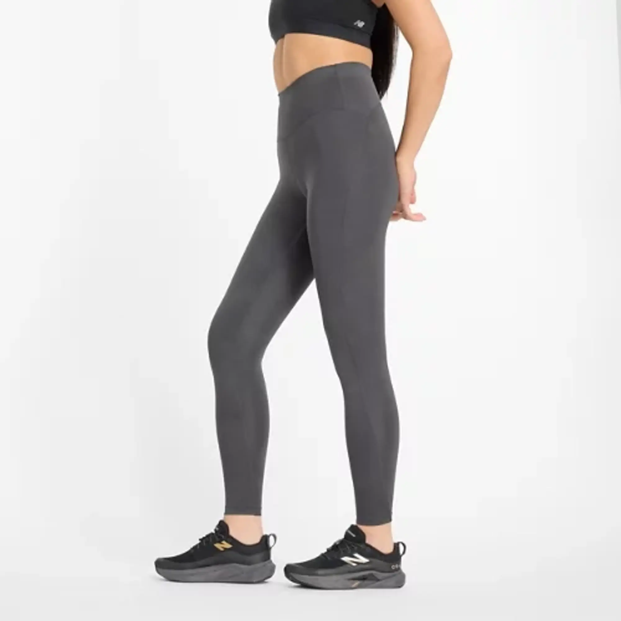 New Balance Women's Athletics Reflective Warming High Rise Legging 27 in Black Poly Knit