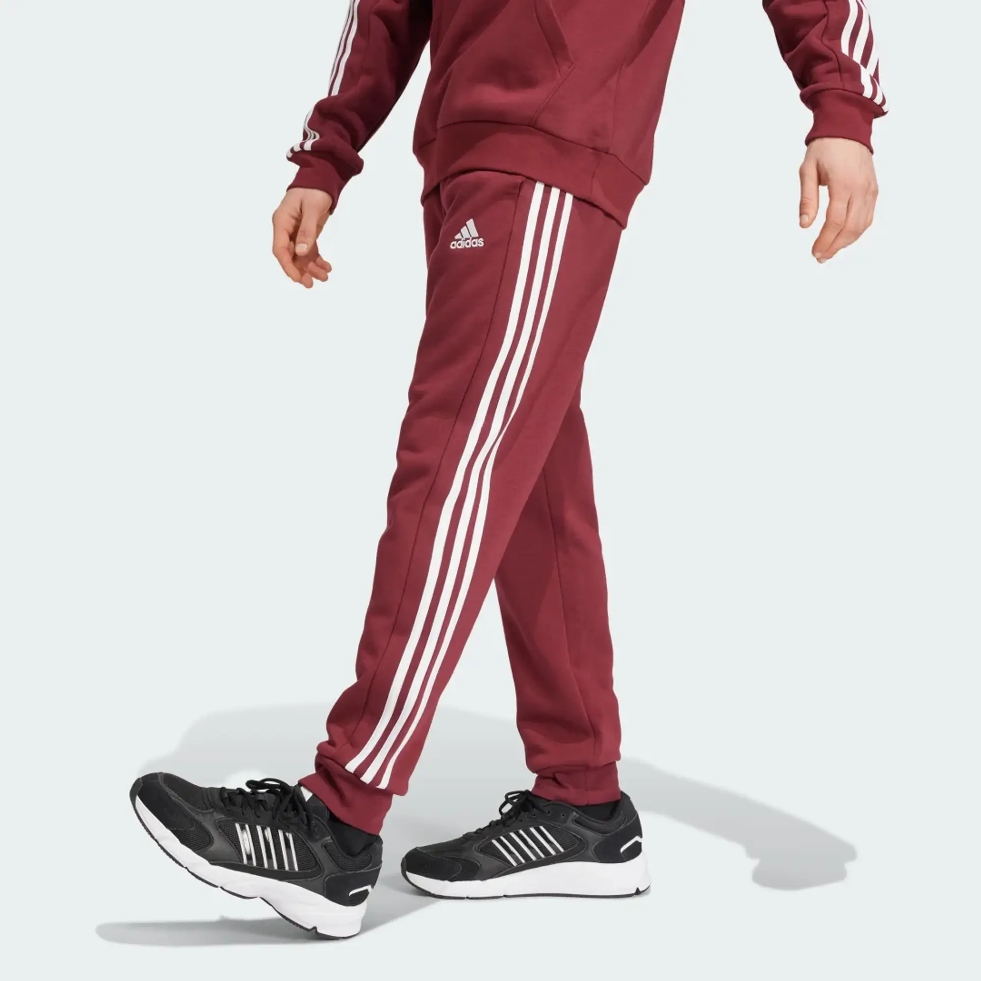 Manchester United x adidas Mens Essentials Fleece 3-Stripes Tapered Joggers Burgundy