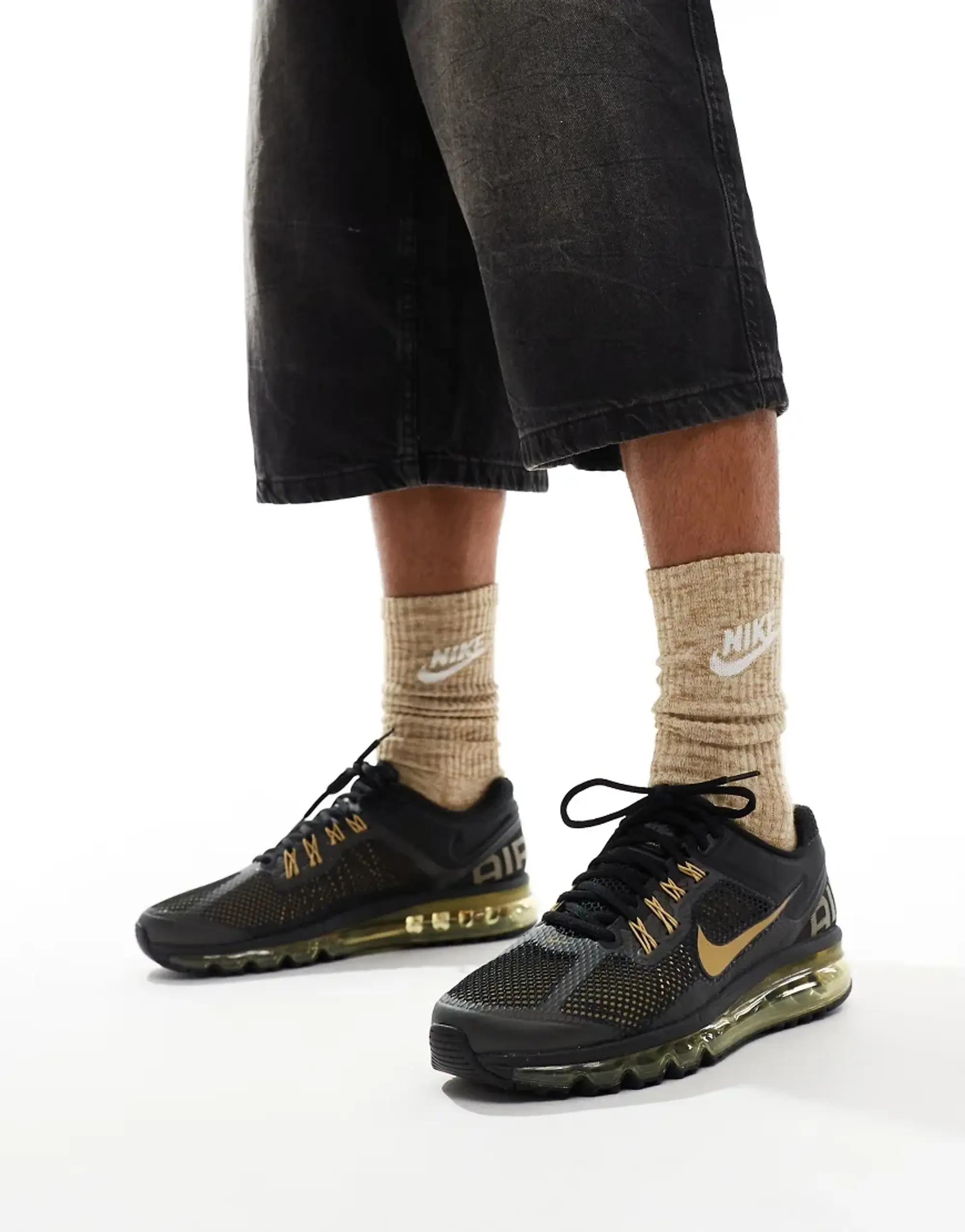 Nike black and gold trainers on sale