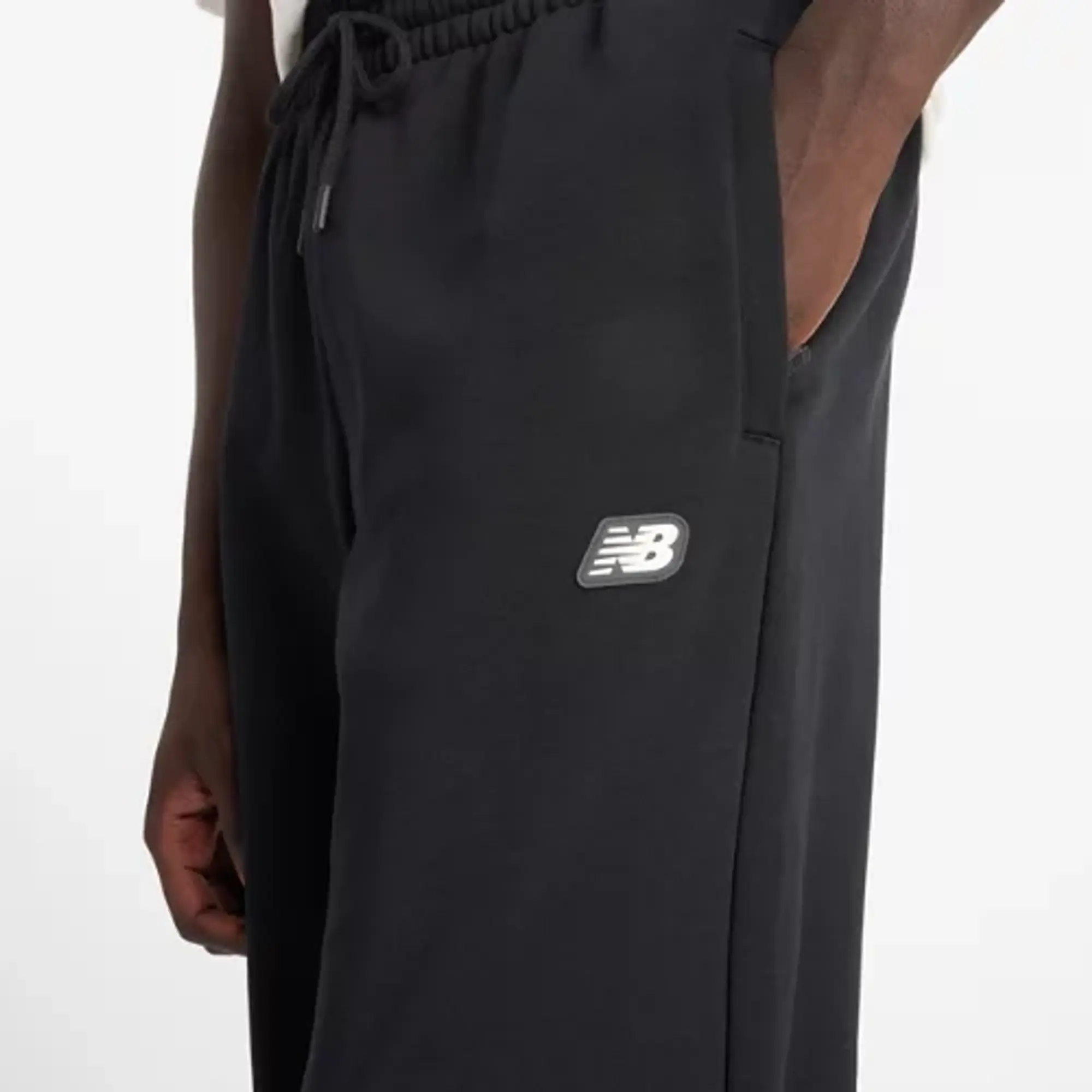 New Balance Men's All Day Uniform Pant in Black Poly Knit
