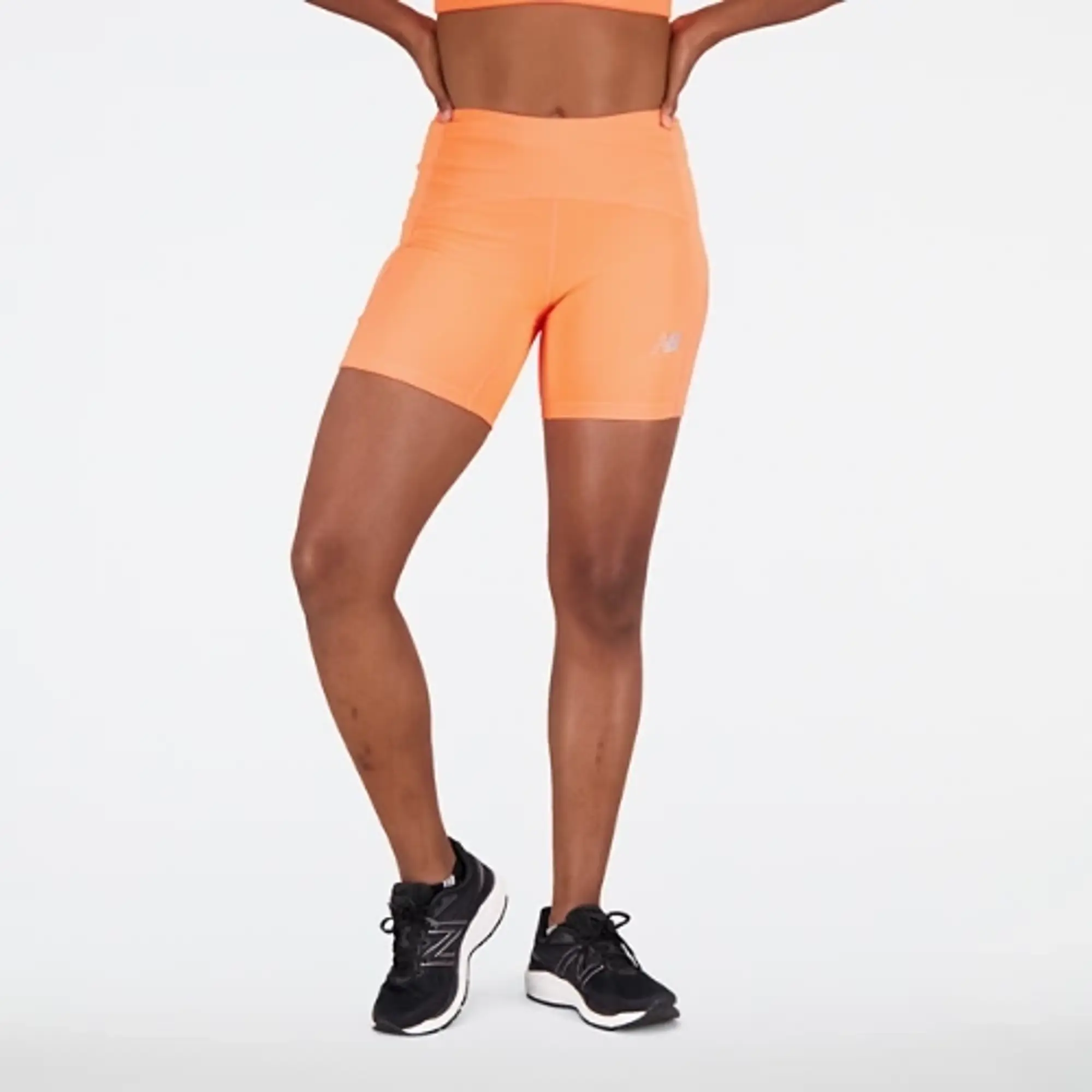 New Balance Women's Impact Run Fitted Short in Orange Poly Knit