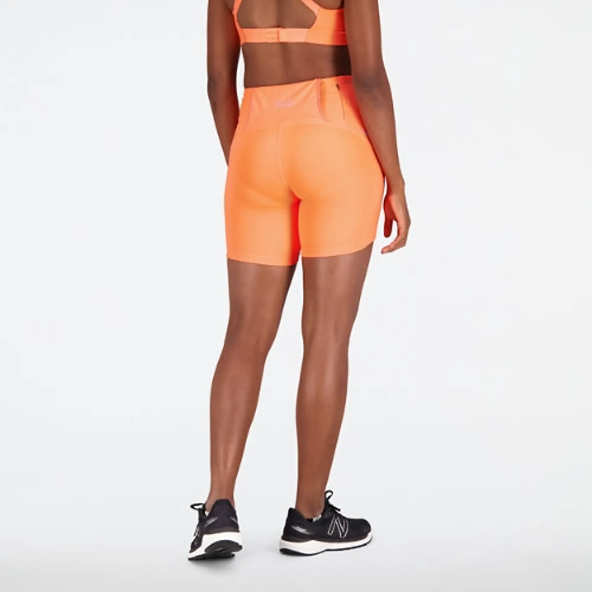 New Balance Women's Impact Run Fitted Short in Orange Poly Knit