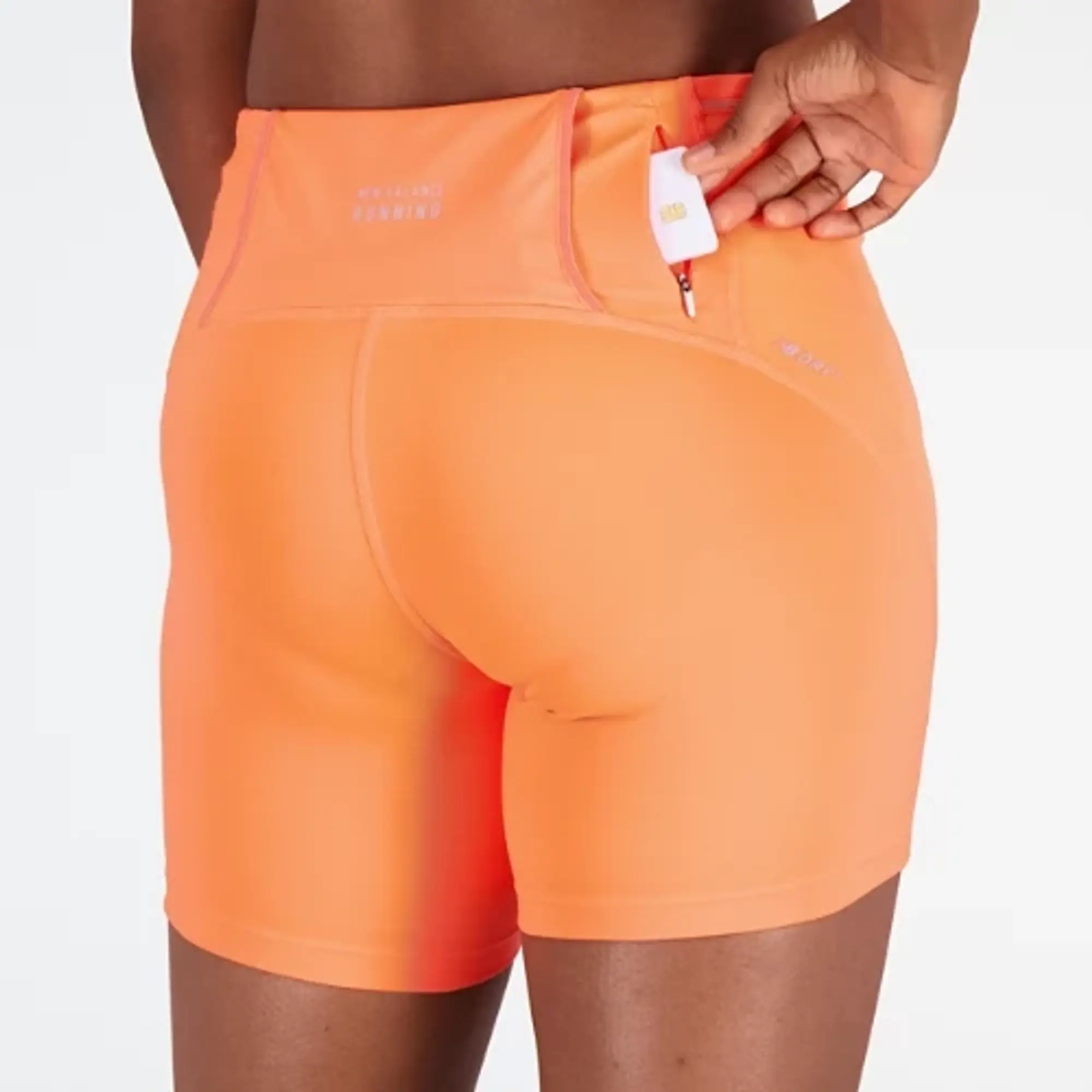 New Balance Women's Impact Run Fitted Short in Orange Poly Knit