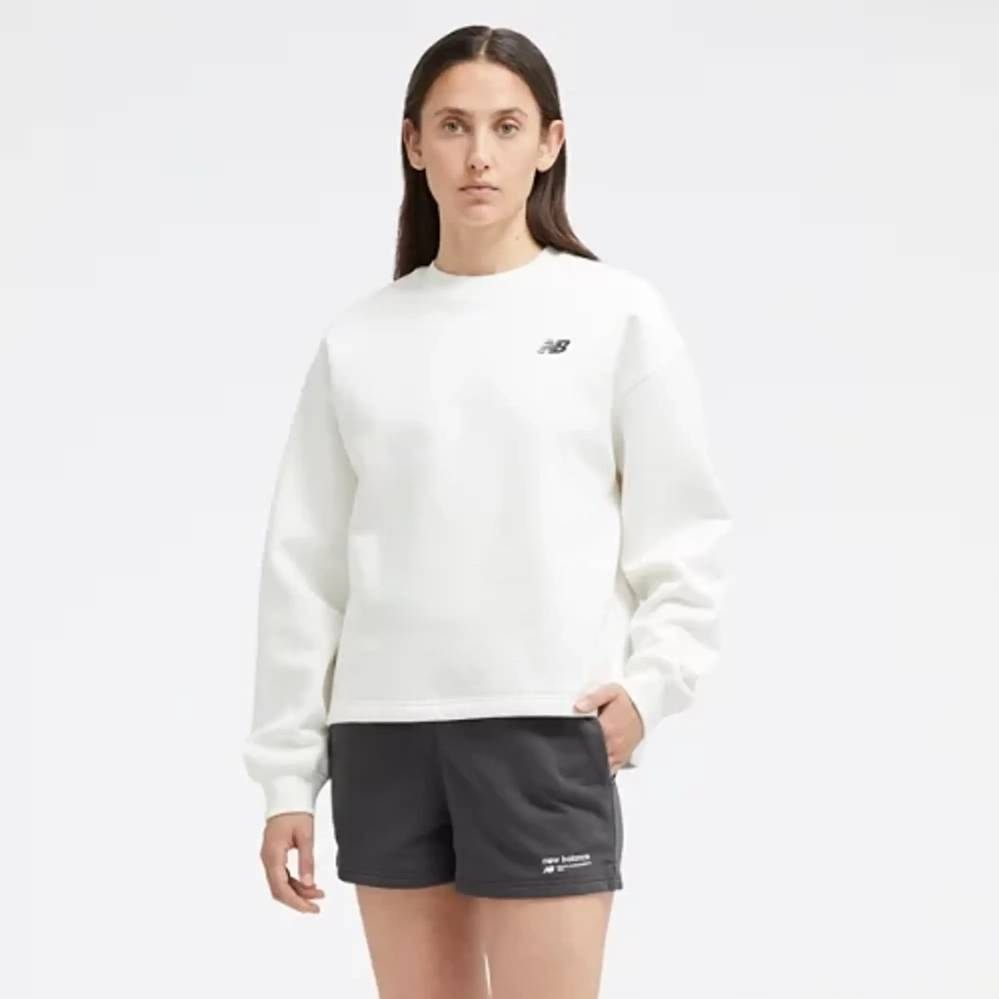 New Balance Women's Linear Heritage Brushed Back Fleece Crewneck in White Poly Fleece