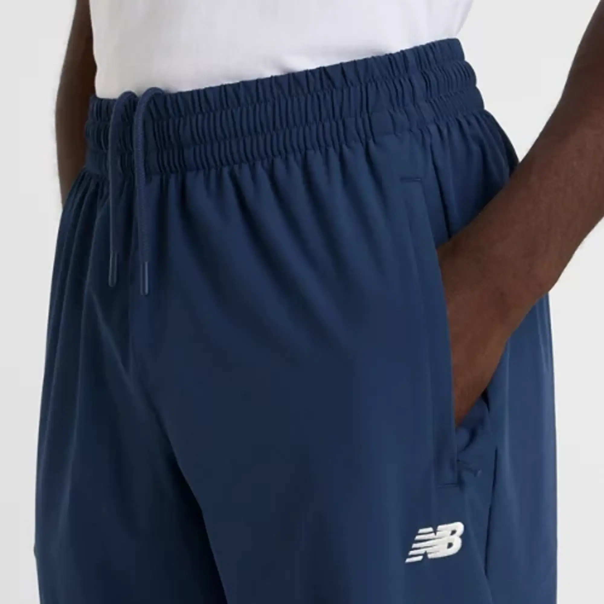 New Balance Men's In Game Woven Track Pant in Blue Polywoven
