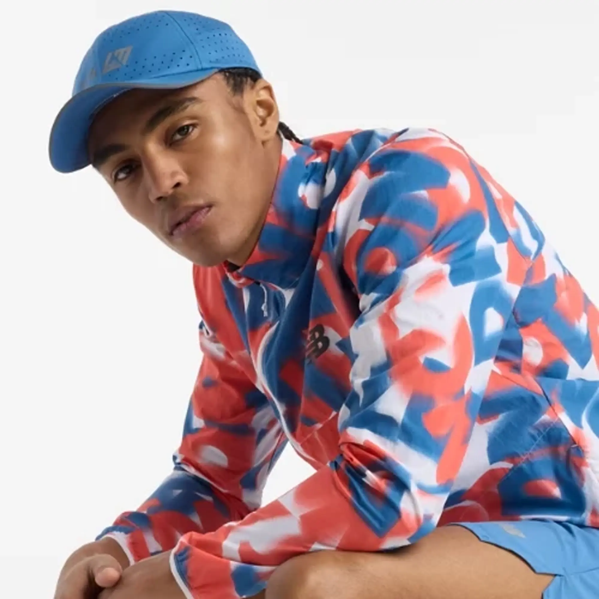New Balance Men's London Edition Printed Athletics Packable Jacket in Blue/Pink Polywoven