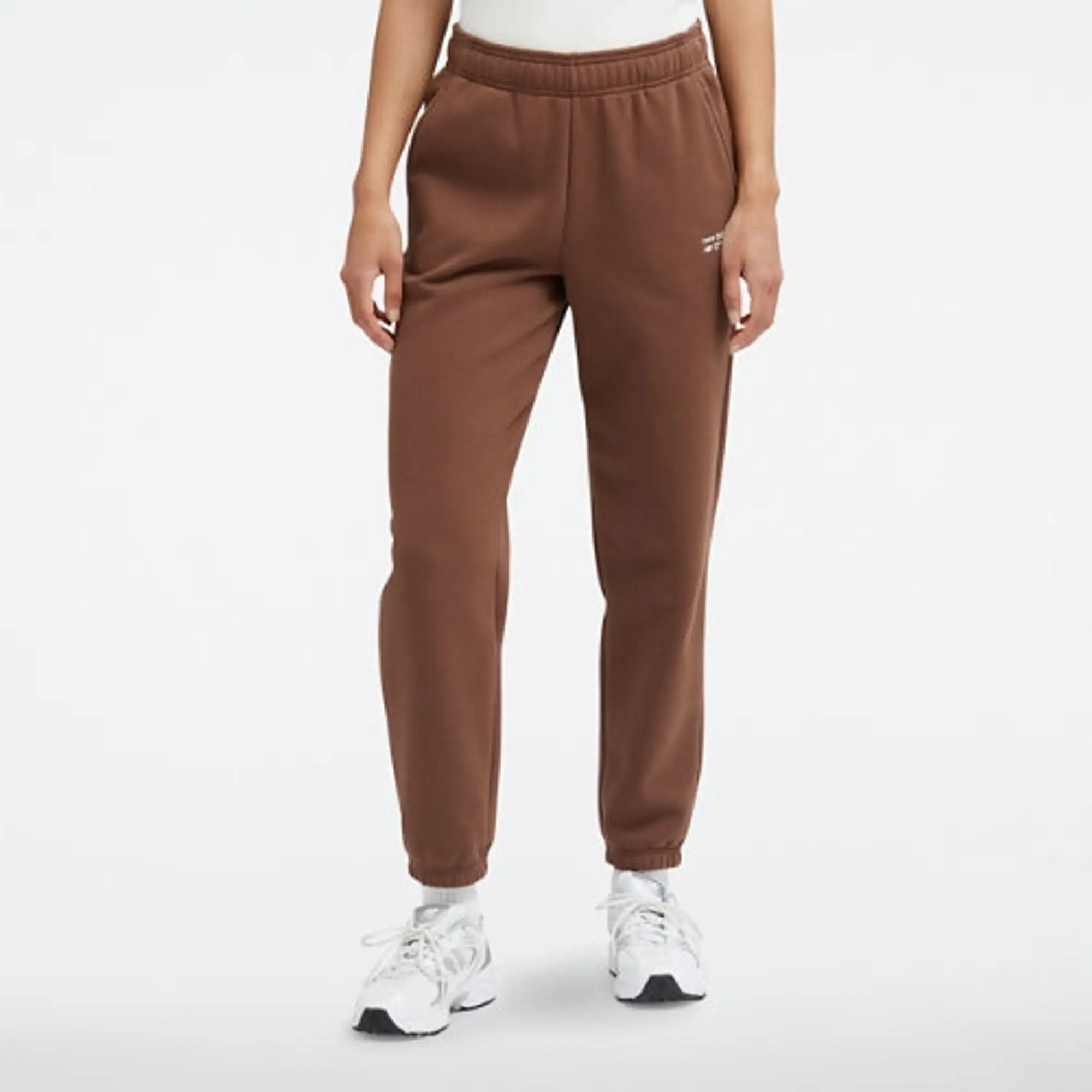 New Balance Women's Linear Heritage Brushed Back Fleece Sweatpant in Brown Poly Fleece