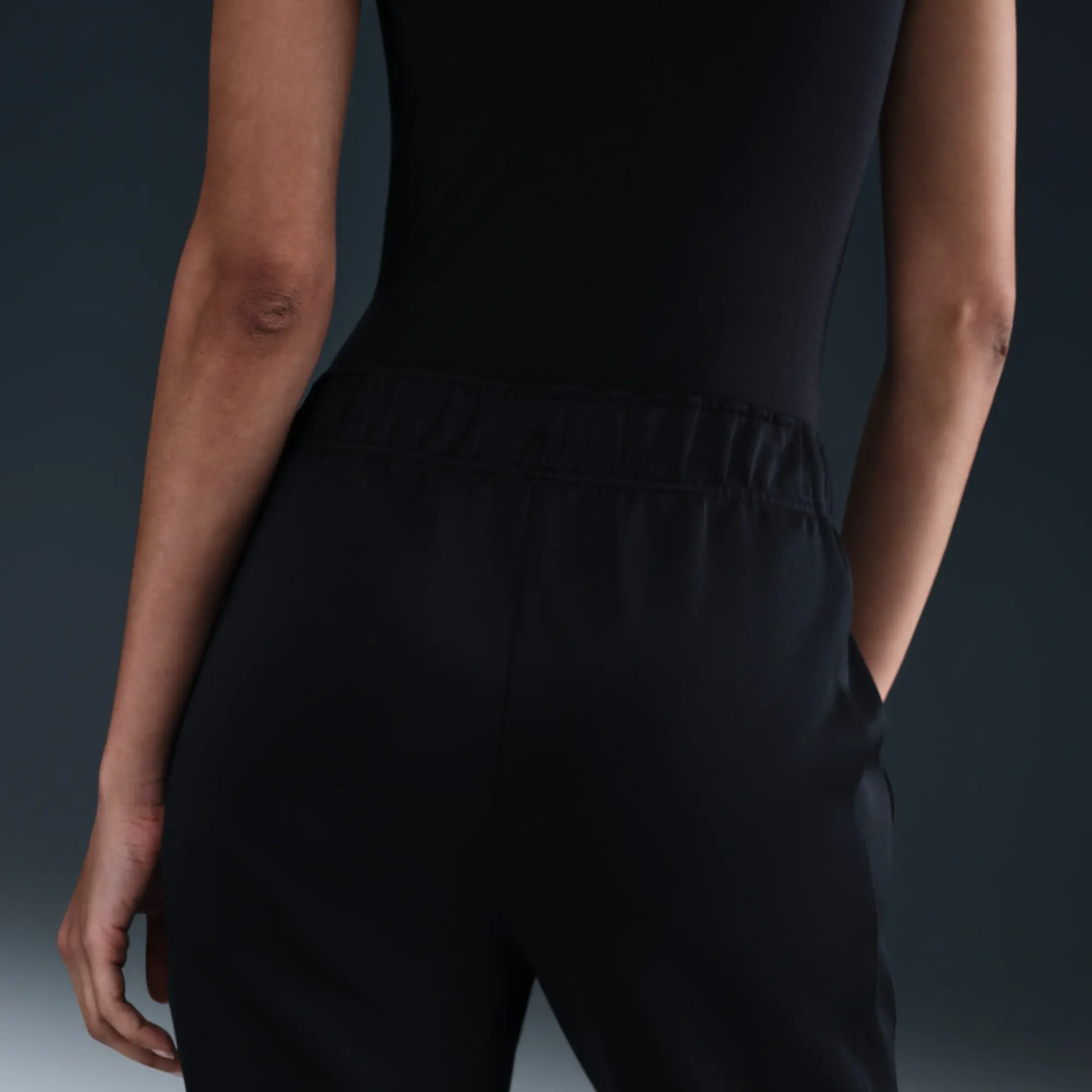Nike Sportswear Windrunner Women's Mid-Rise Slim Knit Trousers - Black - Polyester/Elastane