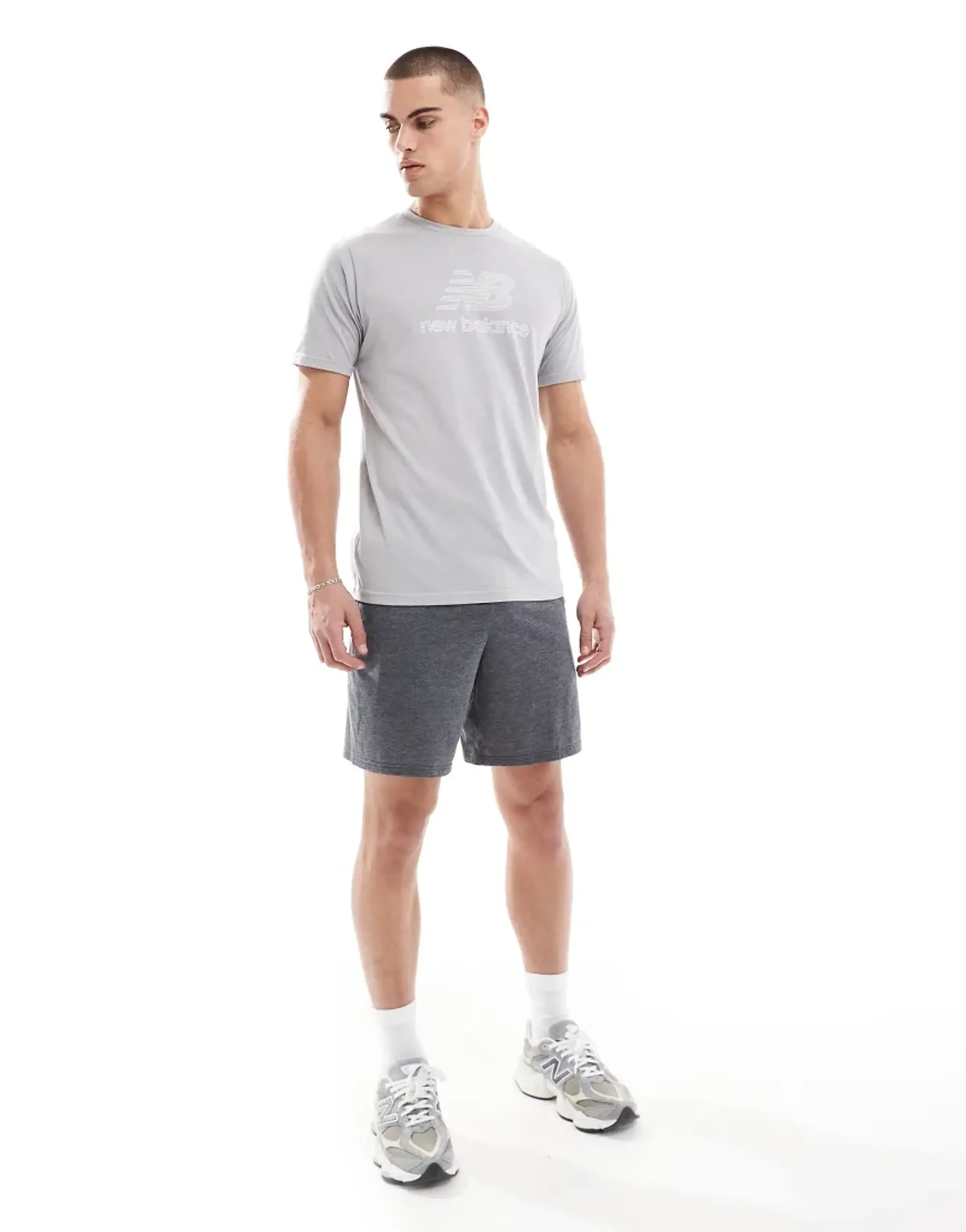 New Balance Men's Sport Essentials Heathertech Short 7" in Black Poly Knit