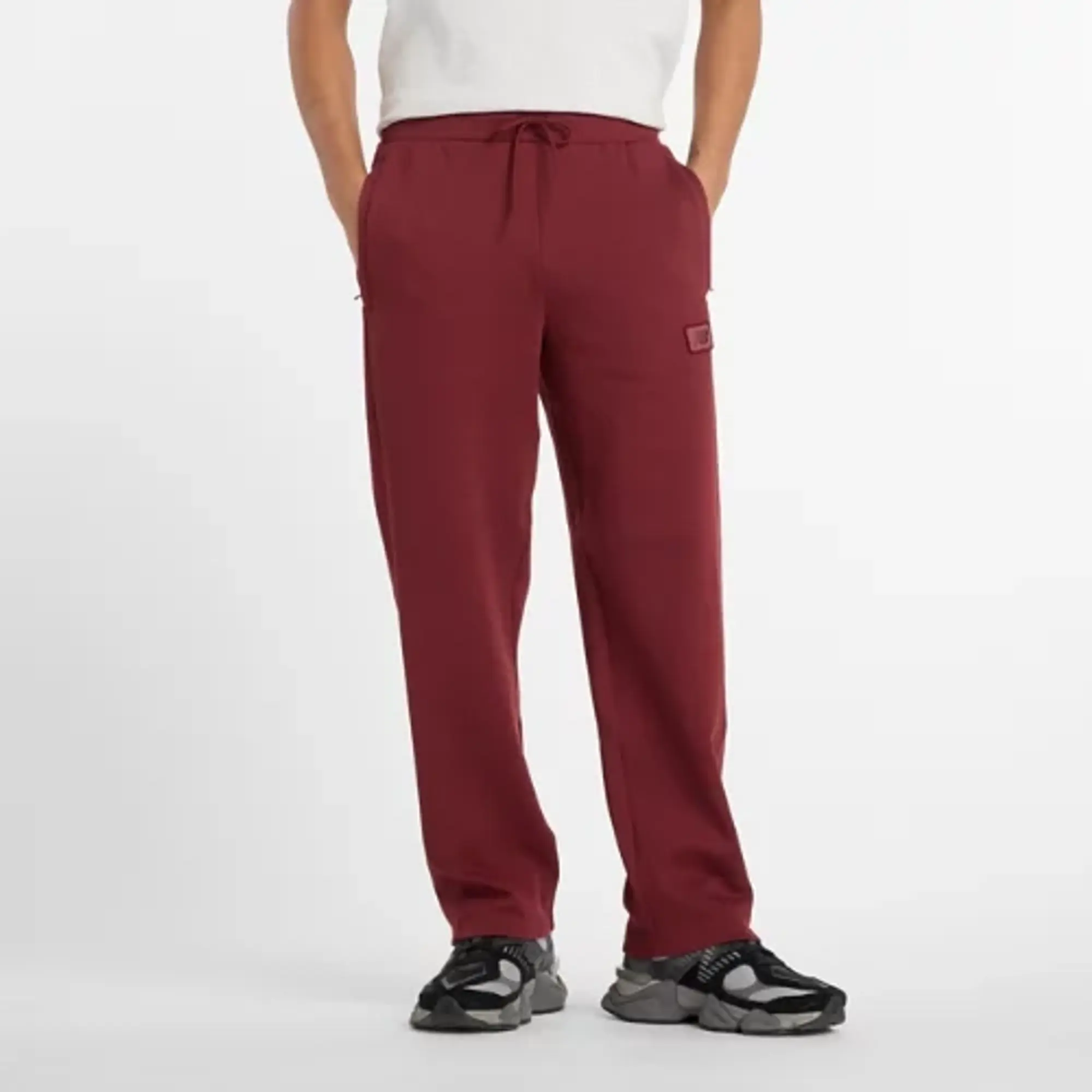 New Balance Men's Post Season Pique Track Pant in Red Poly Knit
