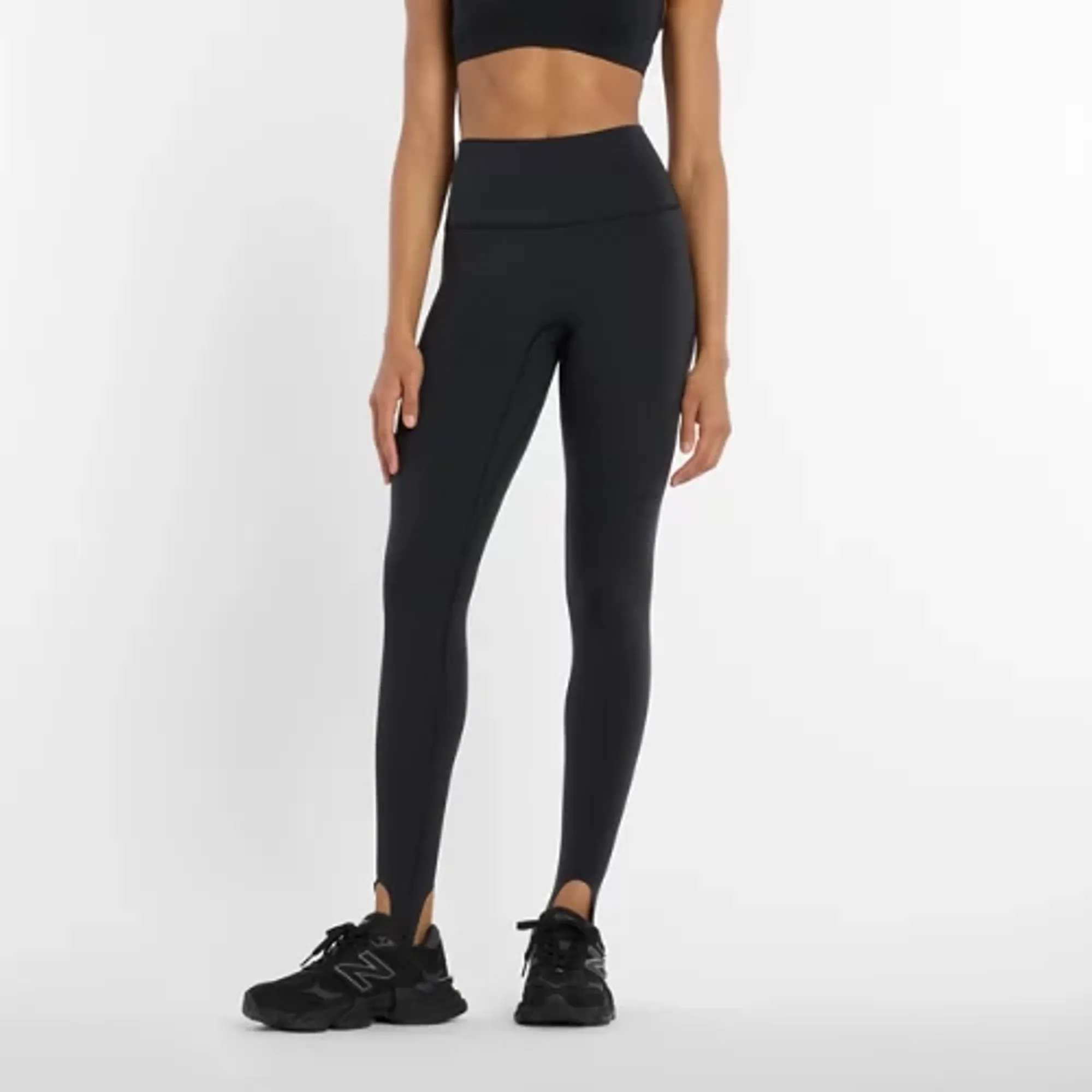 New Balance Women NB Sleek High Rise Stirrup Legging in Black Poly Knit