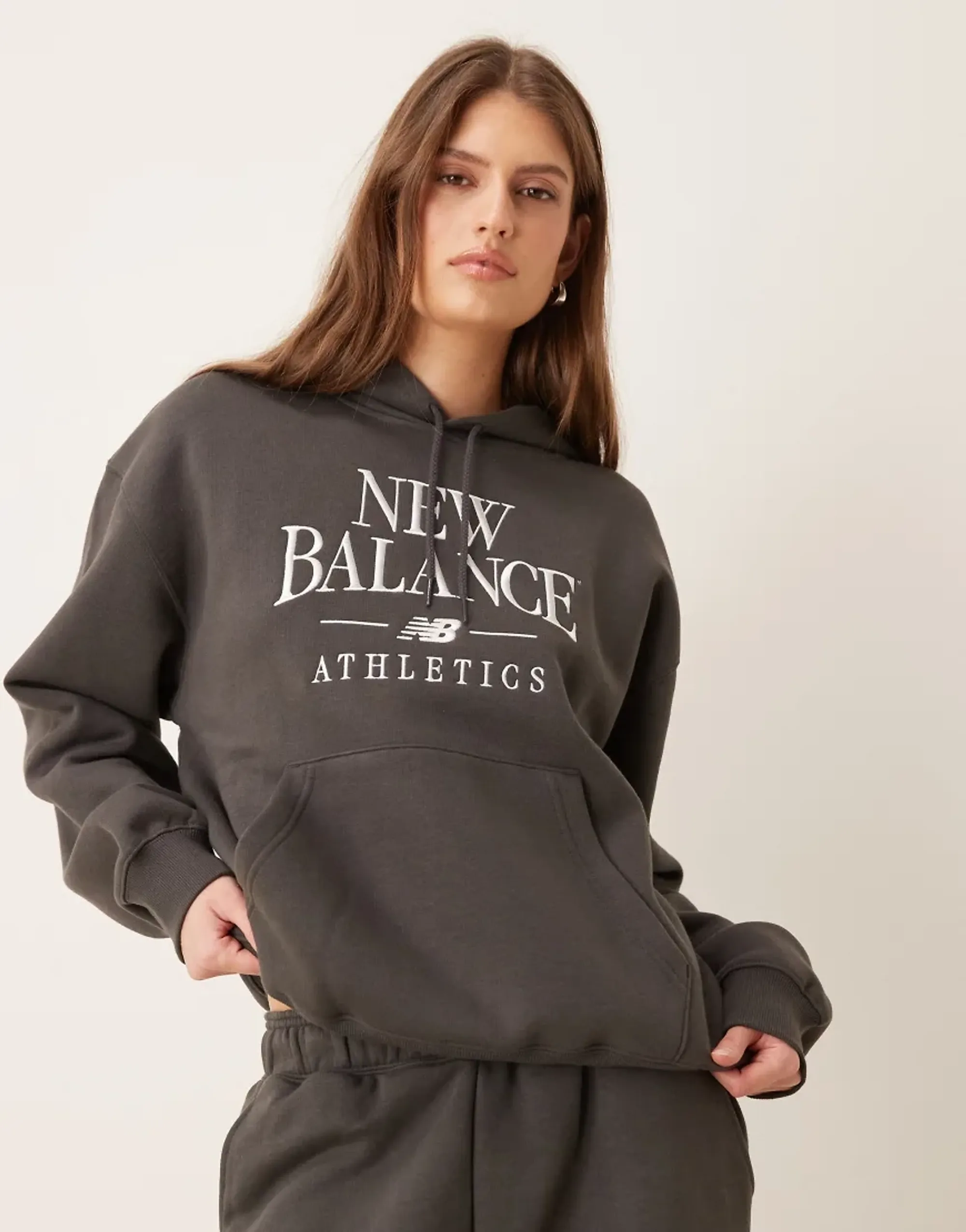 New Balance Women Trackside Fleece Hoodie in Black Cotton Fleece