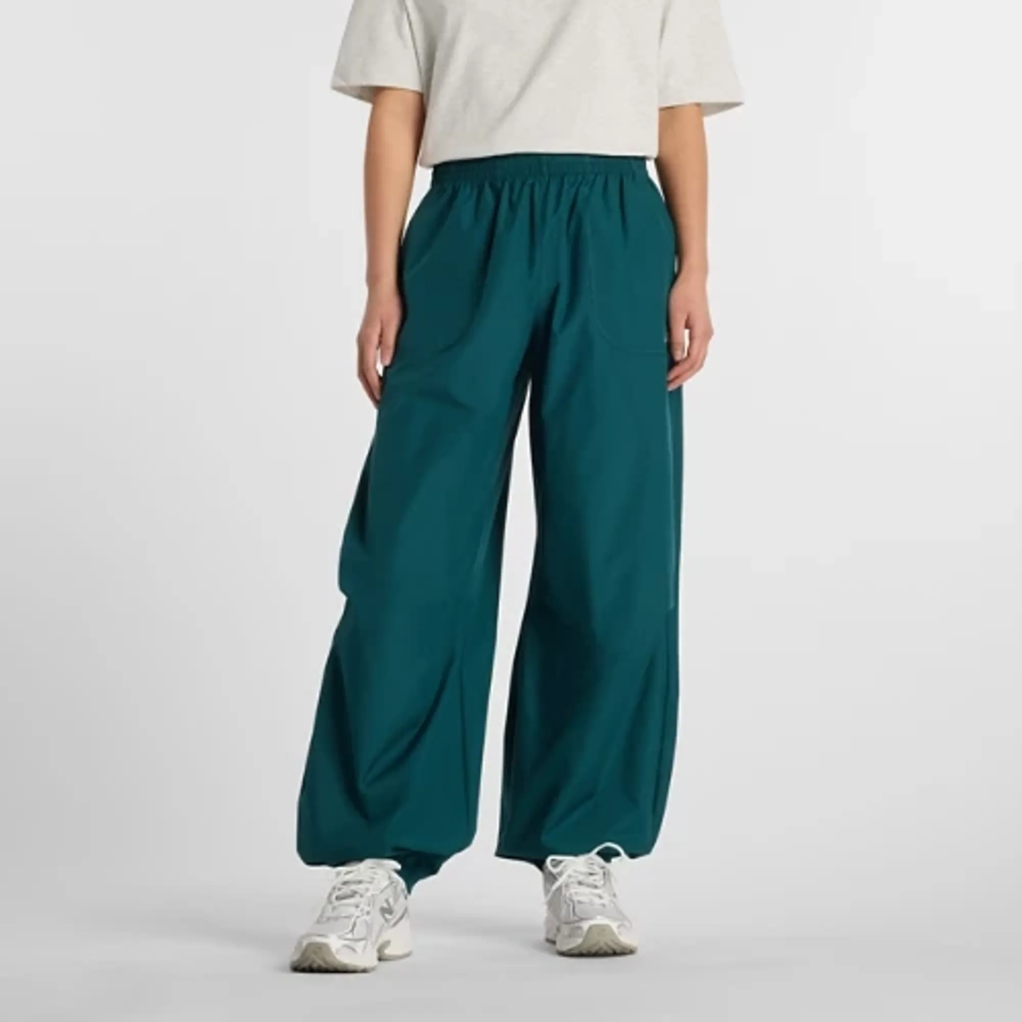 New Balance Women's Trackside Woven Pant in Green Polywoven