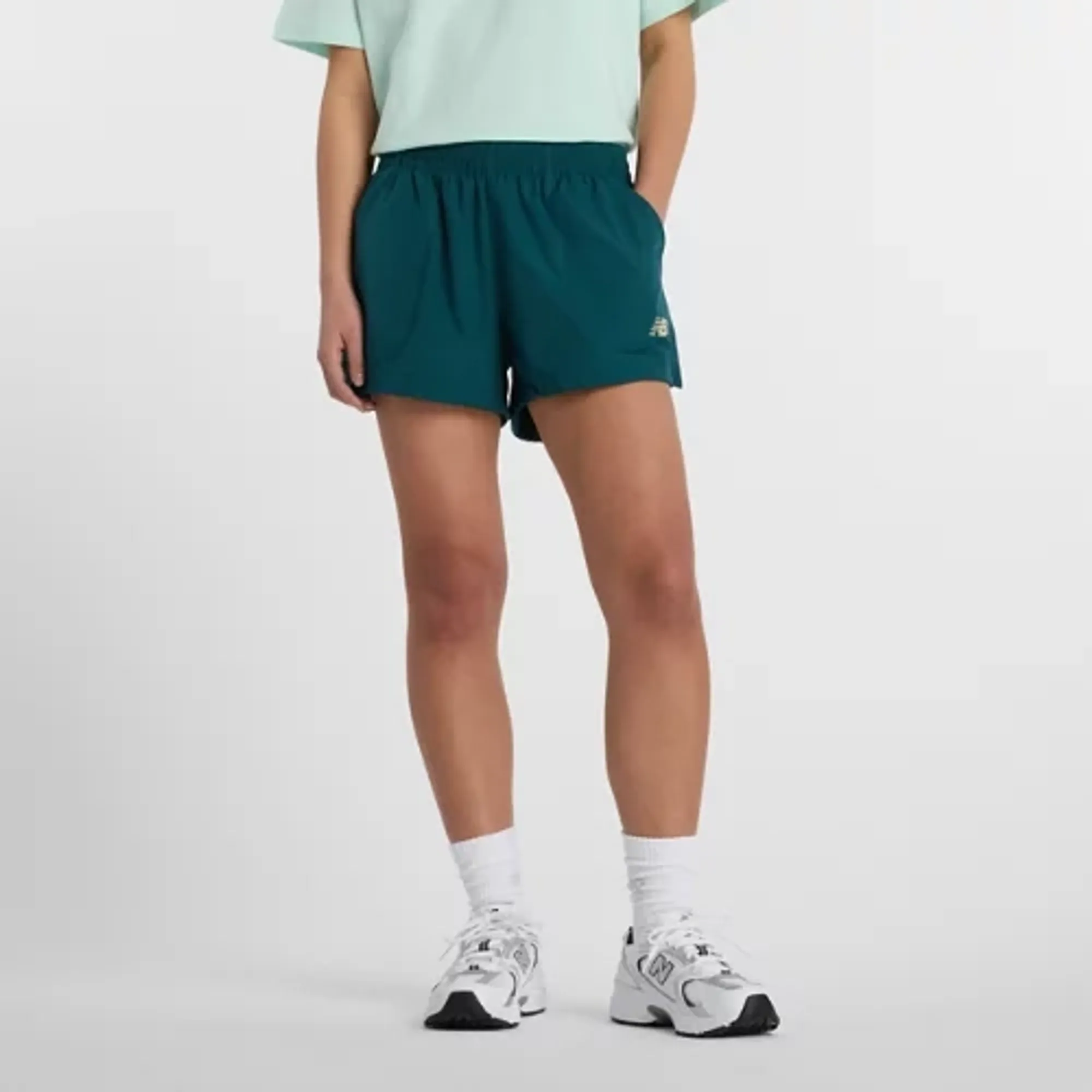 New Balance Women's Trackside Woven Short in Green Polywoven