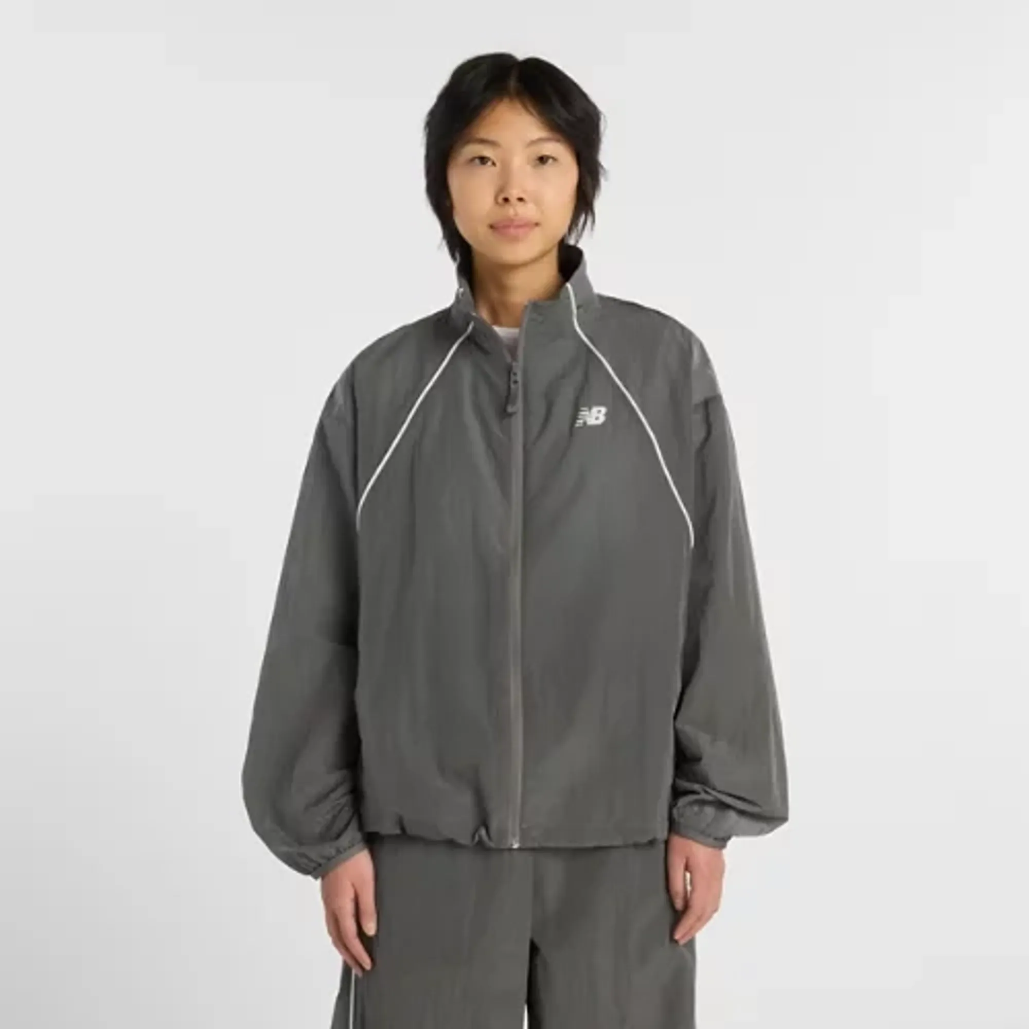 New Balance Women's Sport Legacy Jacket in Grey Polywoven