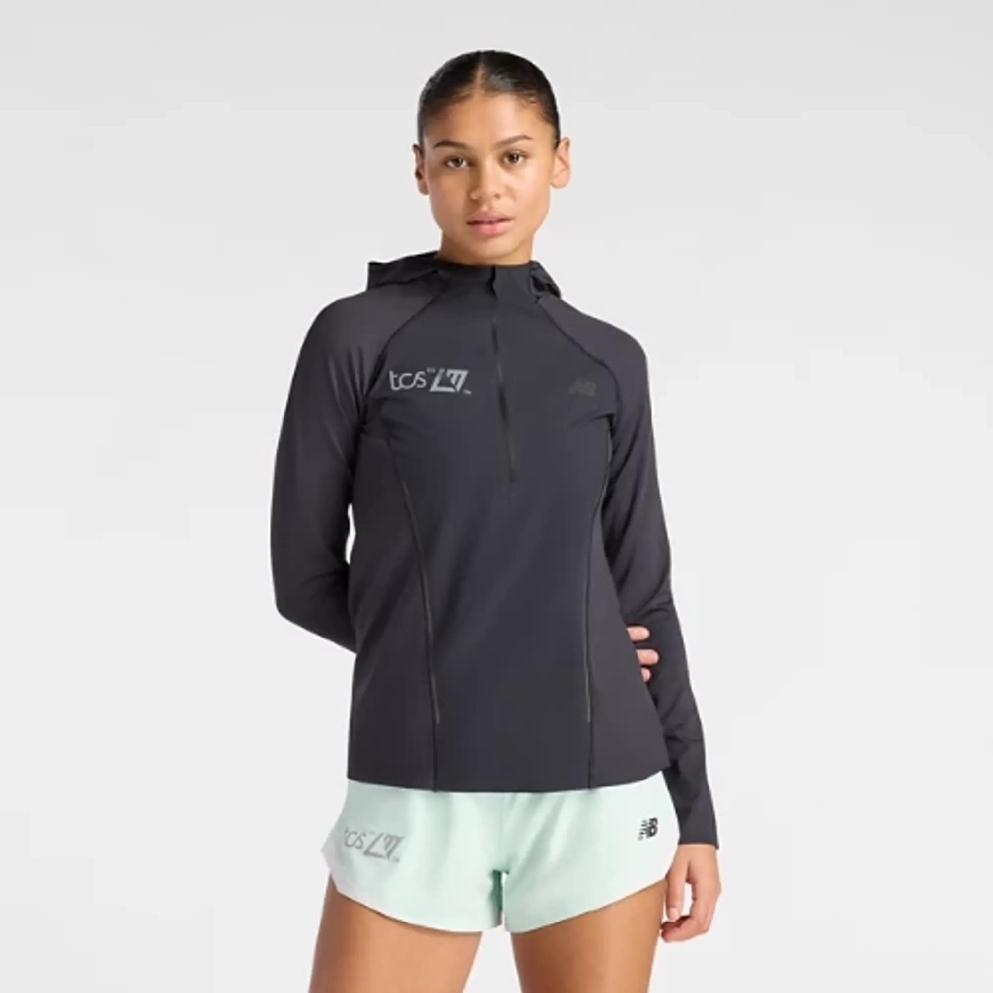 New Balance Women's London Edition Reflective Run Hoodie in Black Polyester