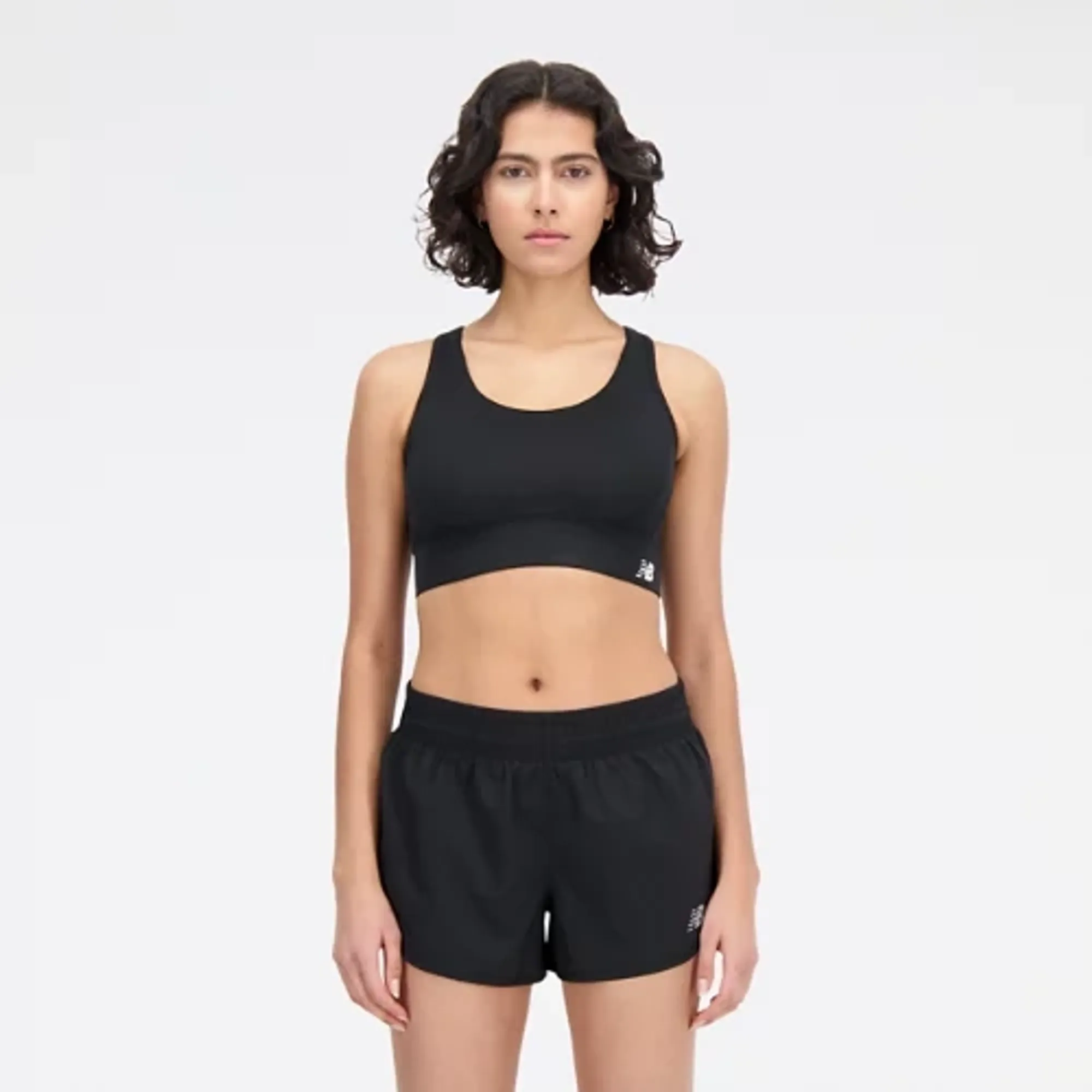 New Balance Women's Tech Training Sports Bra in Black Poly Knit