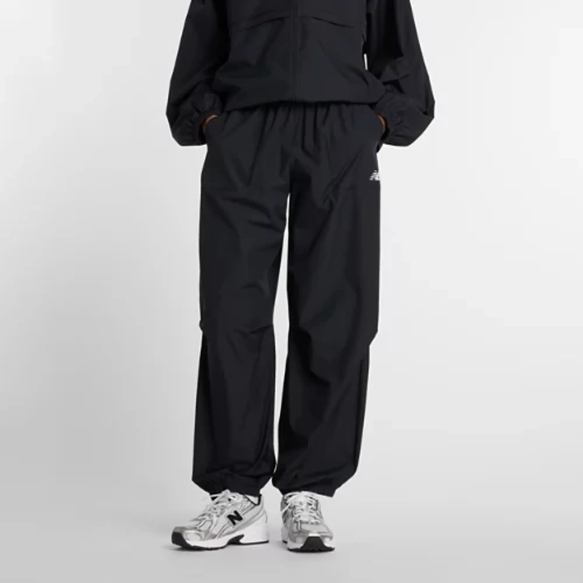New Balance Women's Trackside Woven Pant in Black Polywoven