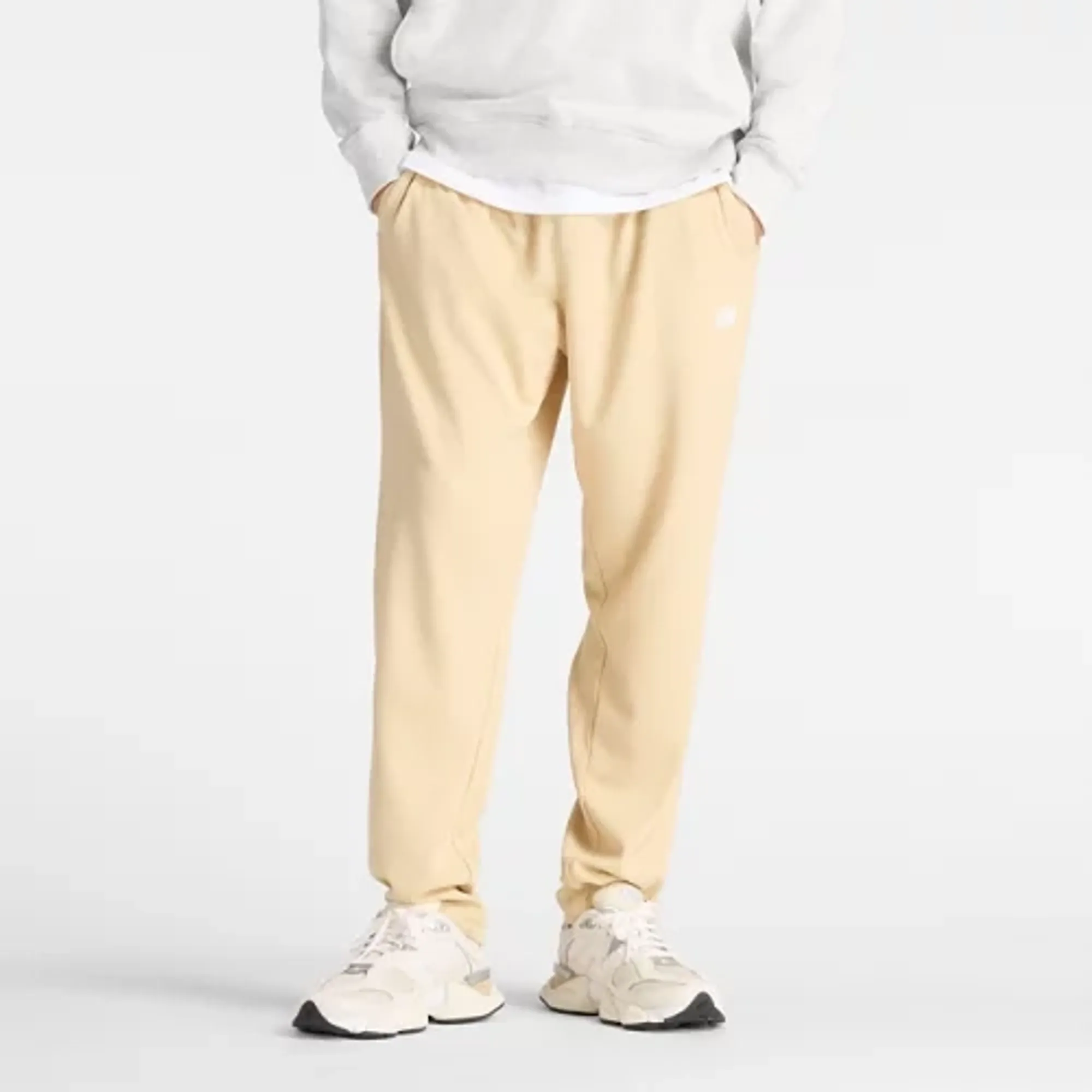 New Balance Men's Textured Check Pant in Brown Polyester