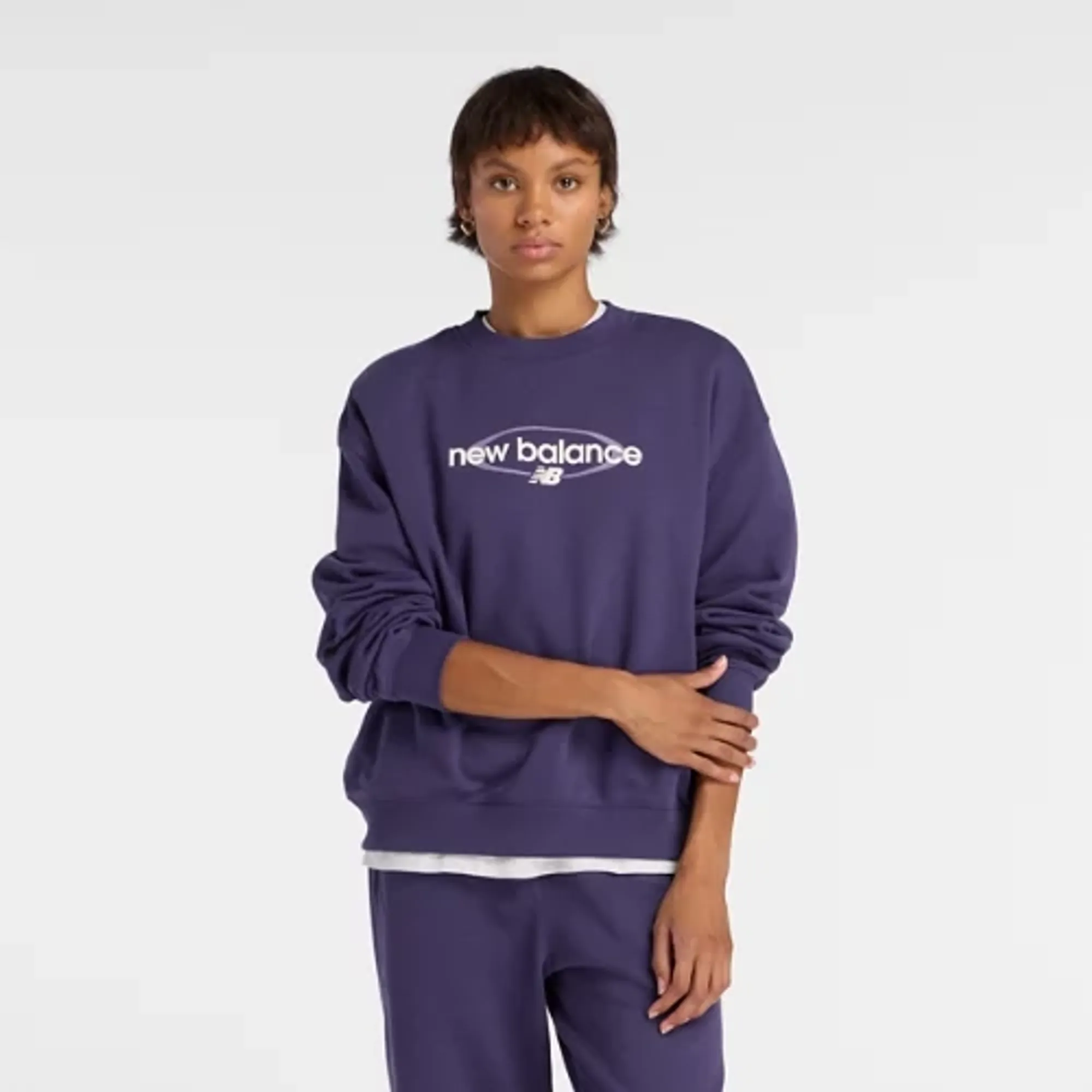 New Balance Women's Sport Graphic Oversized Crew in Purple Cotton Fleece