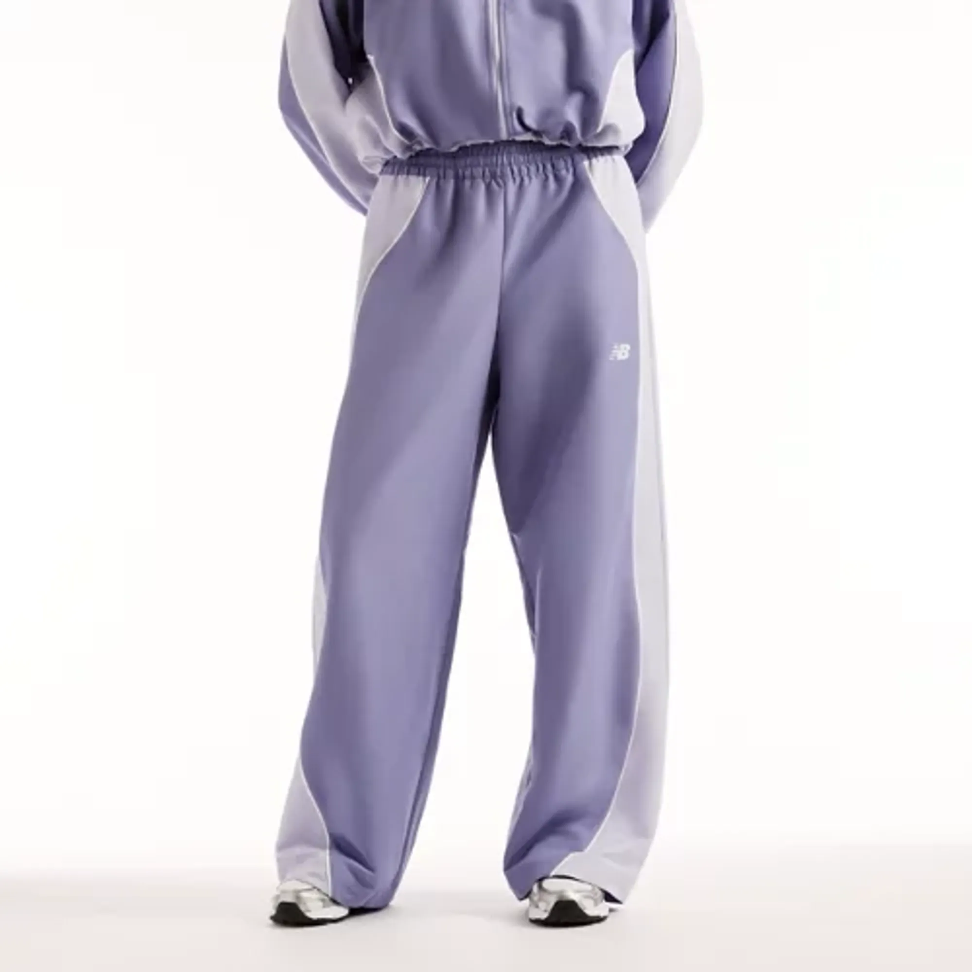 New Balance Women's Trackside Woven Pant in Purple Polywoven