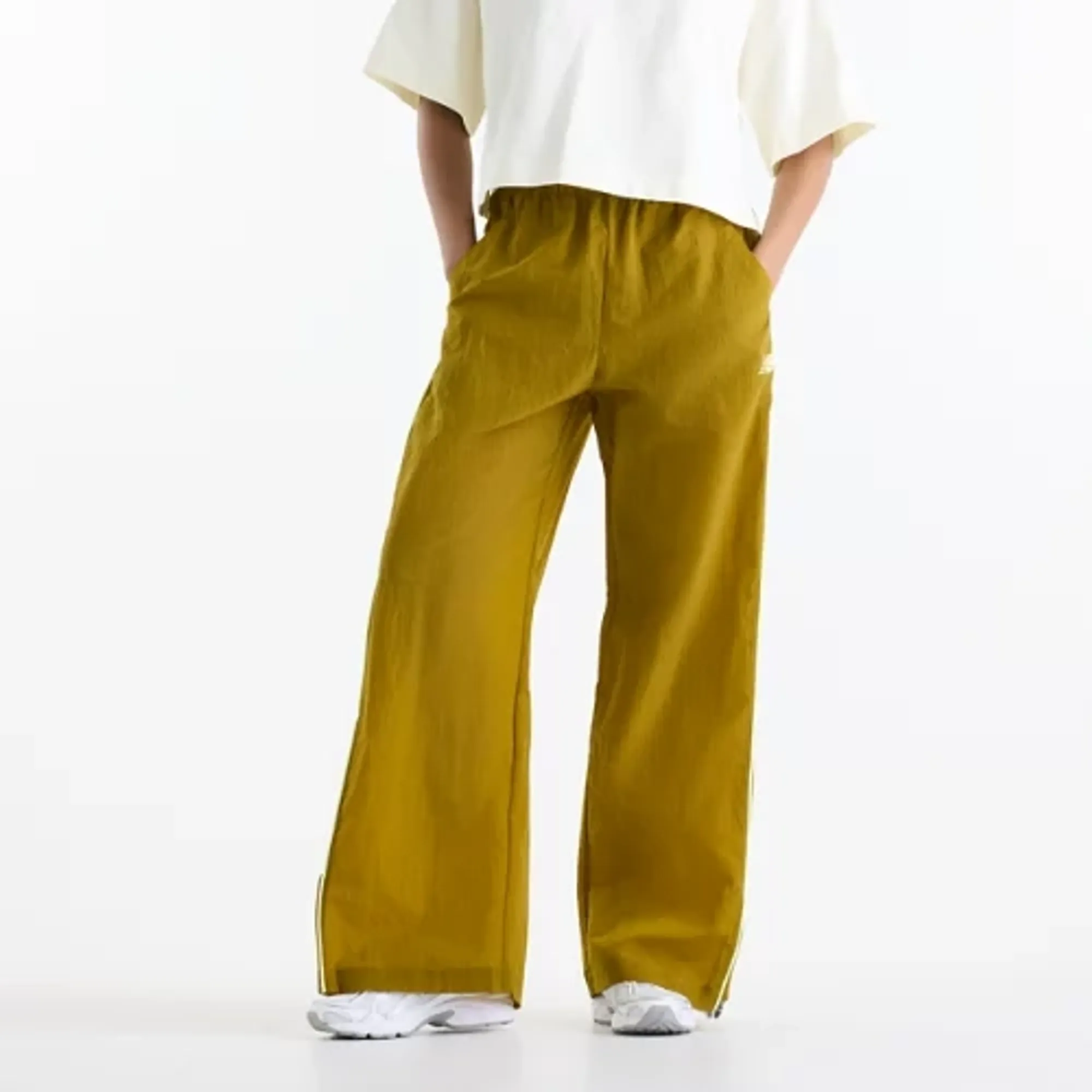 New Balance Women's Sport Legacy Pant in Brown Polywoven